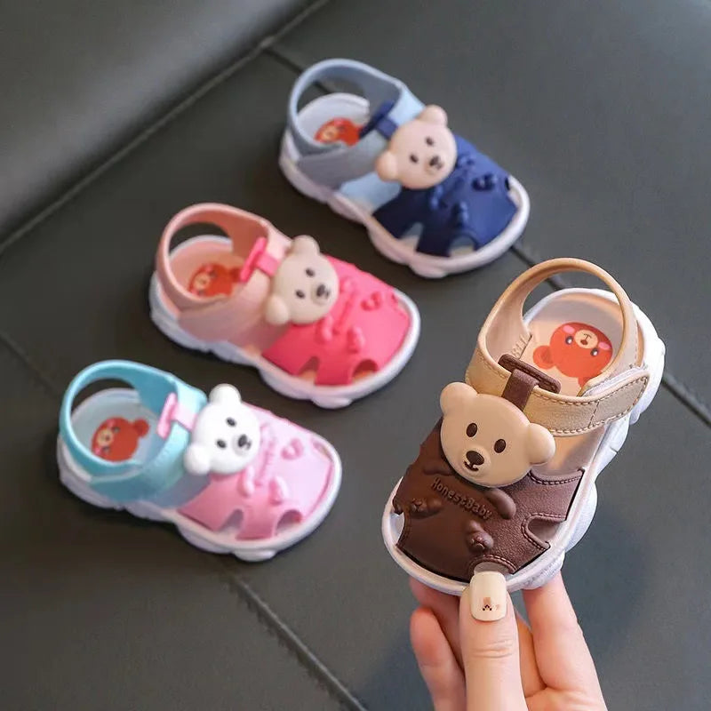Showlu Baby open-toe clogs with anti-slip soft soles, designed for infant walking shoes, featuring a comfortable and lightweight fit.
