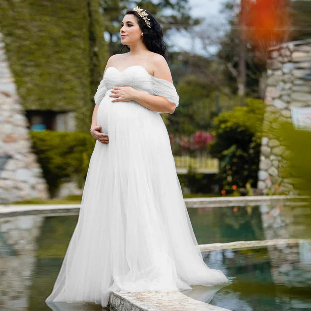 Off-shoulder Showlu Lace Mesh Maternity Gown, a stylish pregnancy photo dress with elegant lace details for expecting mothers.