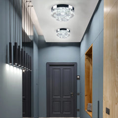 A two-layer crystal flush mount ceiling light with a chrome finish installed in a hallway.