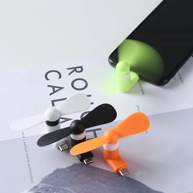 Showlu Smart General USB Mini Fan shown with compact design and adjustable blades for portable cooling.