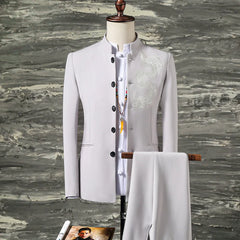 A light gray slim-fit men's suit featuring a stand-collar blazer with dragon embroidery.