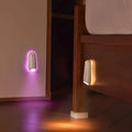Showlu Smart General motion sensor mouse LED night light illuminating a desk with a sleek, modern design and soft white glow.