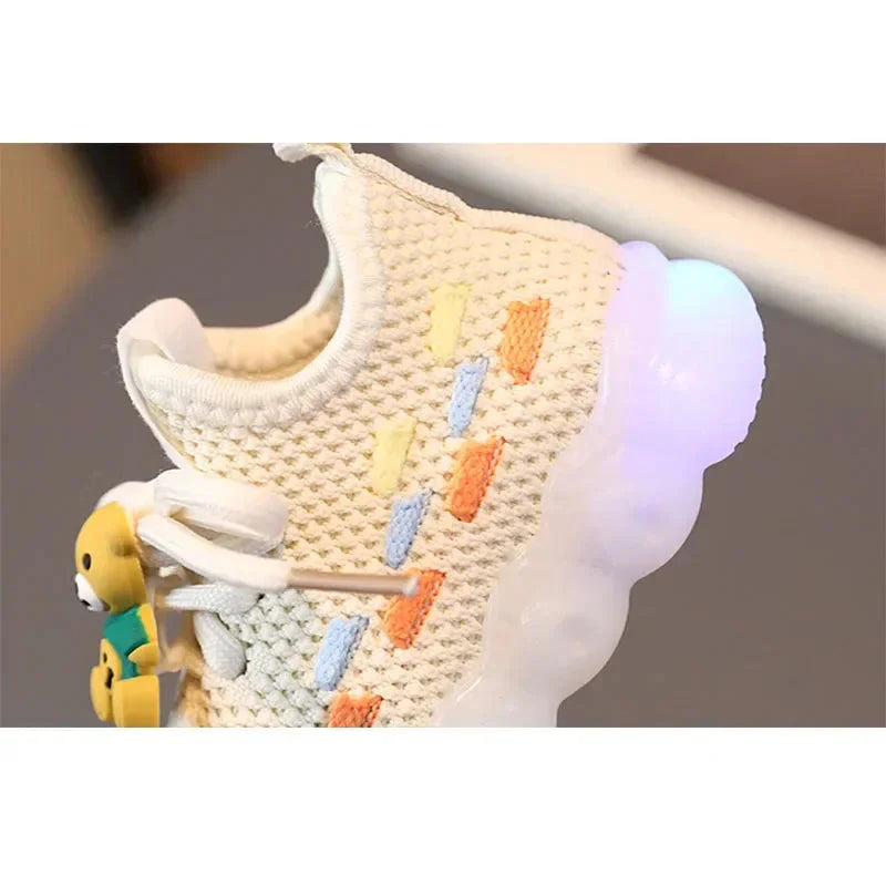 Unisex Showlu Fashion Kids luminous LED sneakers with PU leather, featuring glowing soles and sporty design.