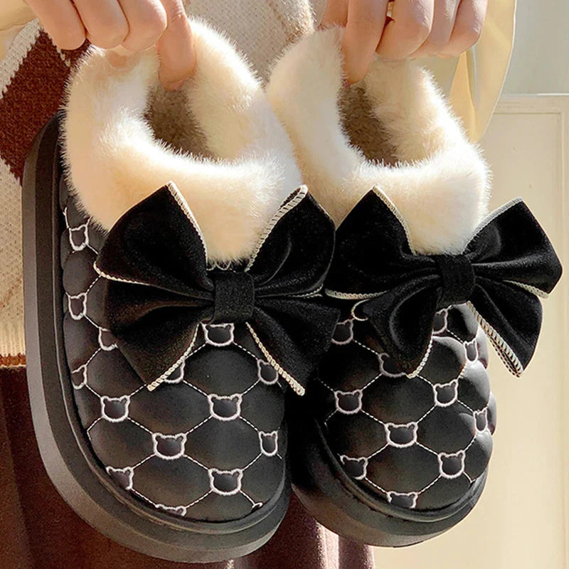 Rimocy women's snow boots with fluffy butterfly platform design, ankle height, black color, stylish and warm winter footwear