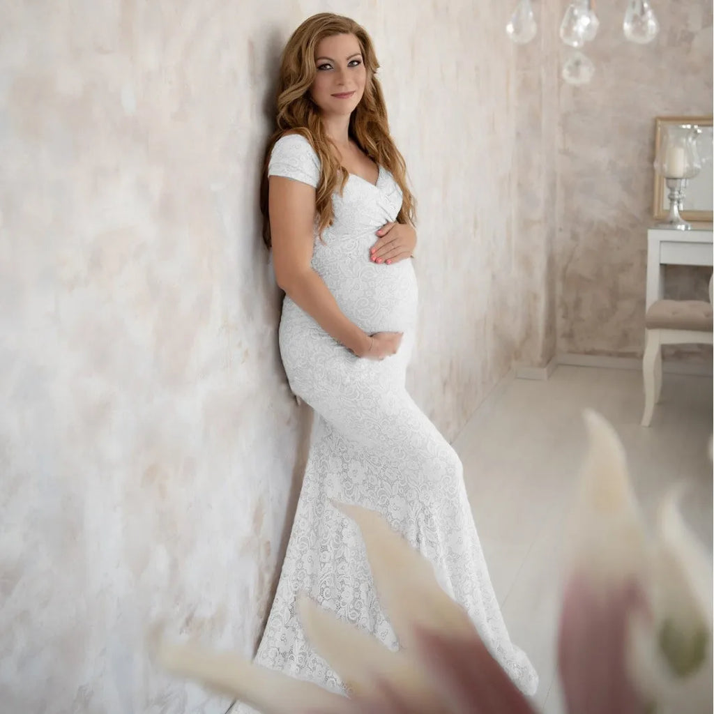 Elegant maternity lace photography dress by Showlu Fashion with short sleeves, train, and flutter sleeves for pregnancy photos.