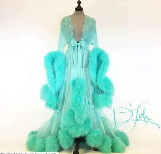 Deep V-neck tulle maternity dress with lace hollow details, long sleeves, feather accents, perfect for photoshoots and special occasions.
