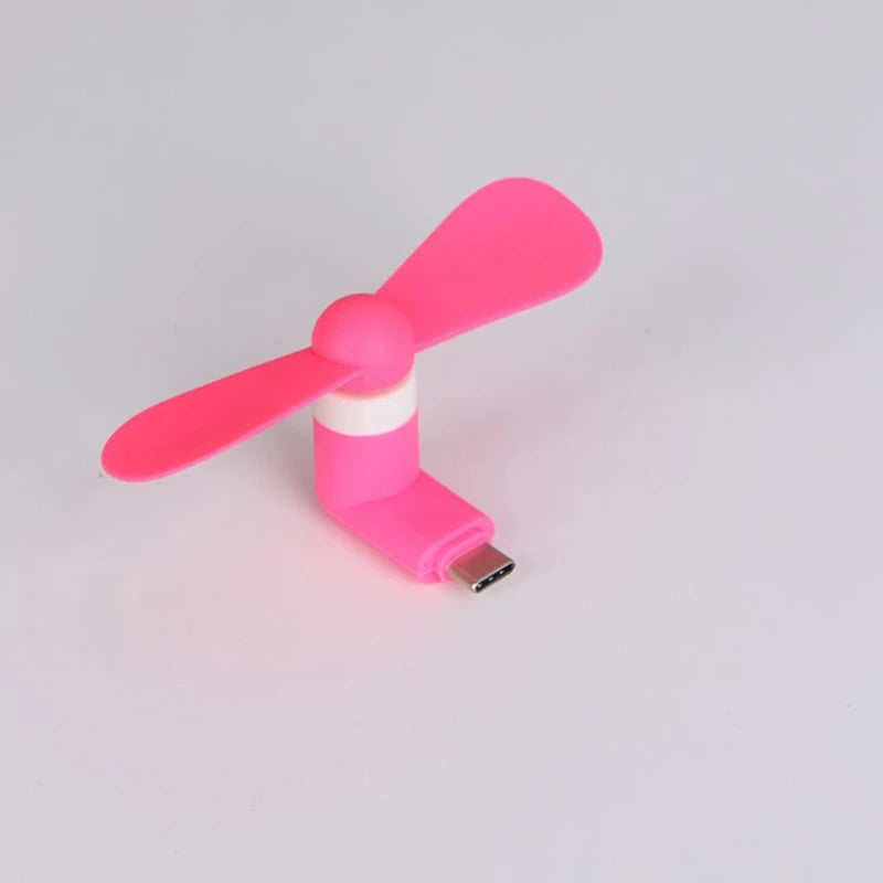 Showlu Smart General USB Mini Fan with foldable blades and adjustable tilt, compact portable cooling device.