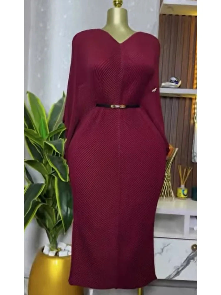 Miyake pleated V-neck foreign style lace-up dress with bat sleeves and thin waist, ideal for spring women's fashion.