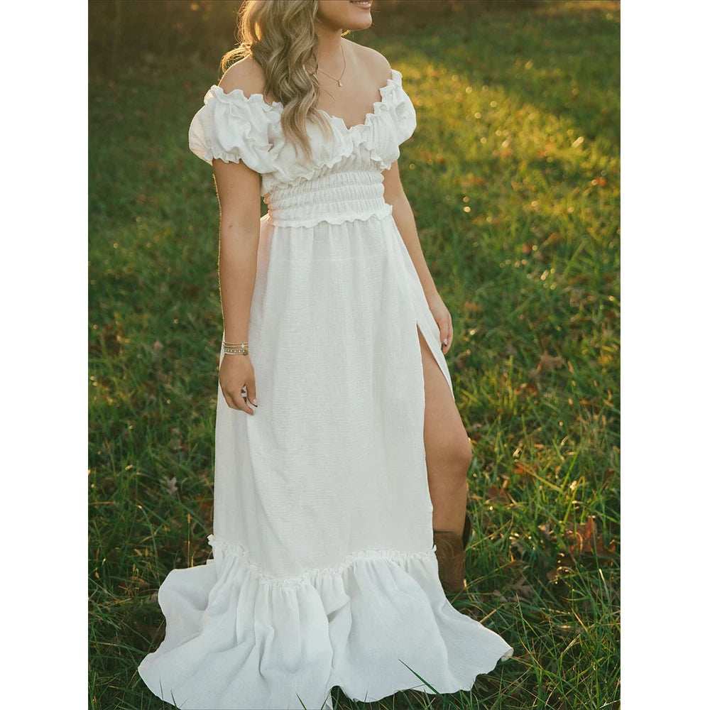 Showlu Bohemian maternity maxi gown with off-shoulder ruffled design, flowing fabric, perfect for maternity photoshoots.