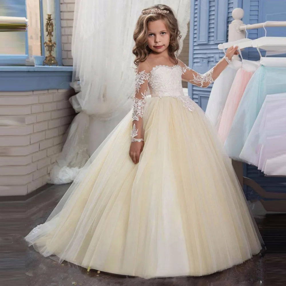 Light pink tulle flower girl dress with white appliques, long sleeves, perfect for weddings, birthdays, and holy communion by Showlu Fashion