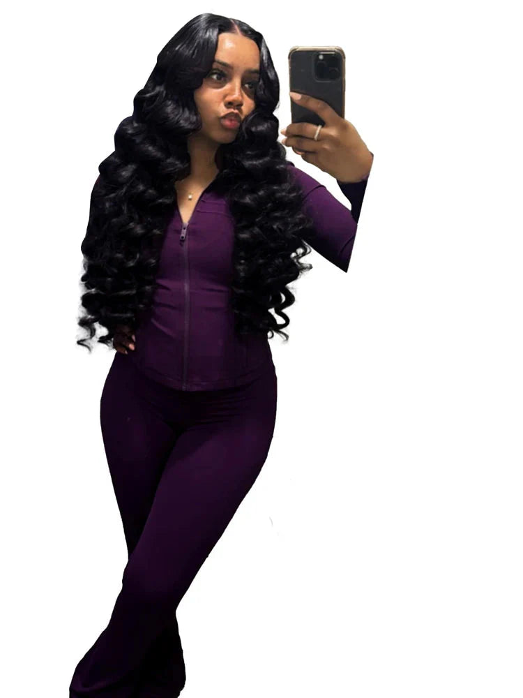 Women's two-piece tracksuit with flared pants and zip-up top by SHOWLU FASHION, featuring stylish and comfortable activewear.