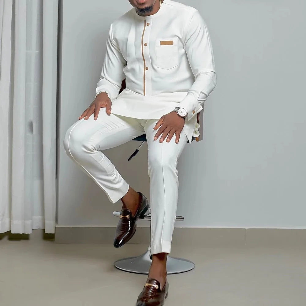 Men's white Kaunda suit from Showlu Fashion Store, traditional African 2-piece cotton set with intricate embroidery details.