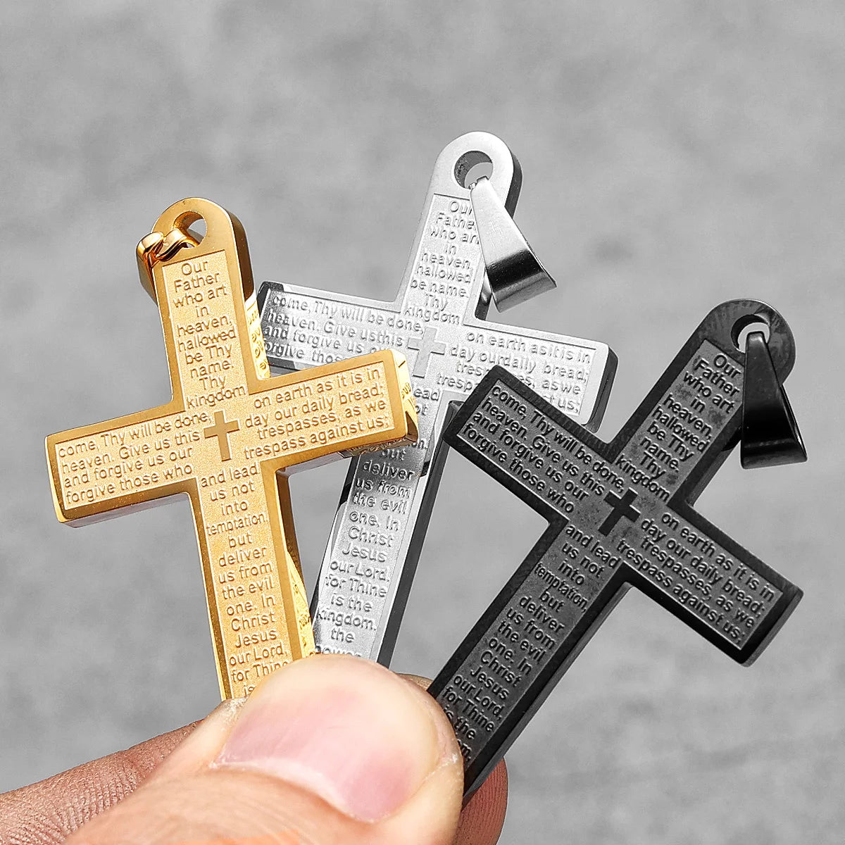Stainless steel cross pendant necklace with punk-inspired design, featuring religious symbolism, on a chain.