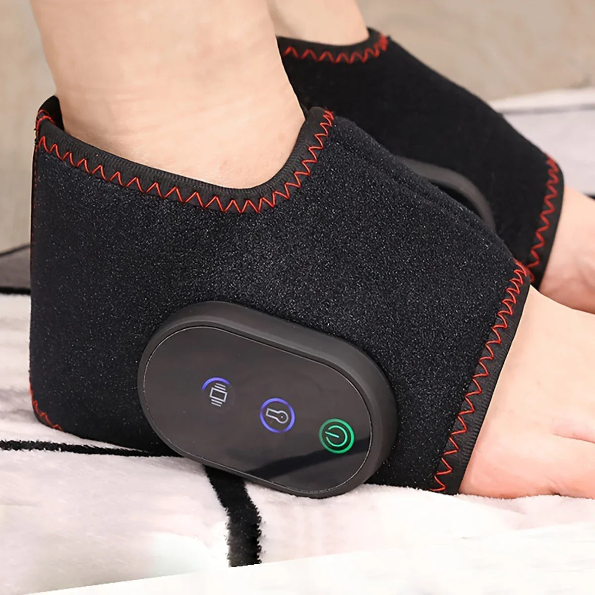 SHOWLU Rechargeable Ankle Massager with vibration and heat therapy, black device resting on an ankle for pain relief and relaxation.