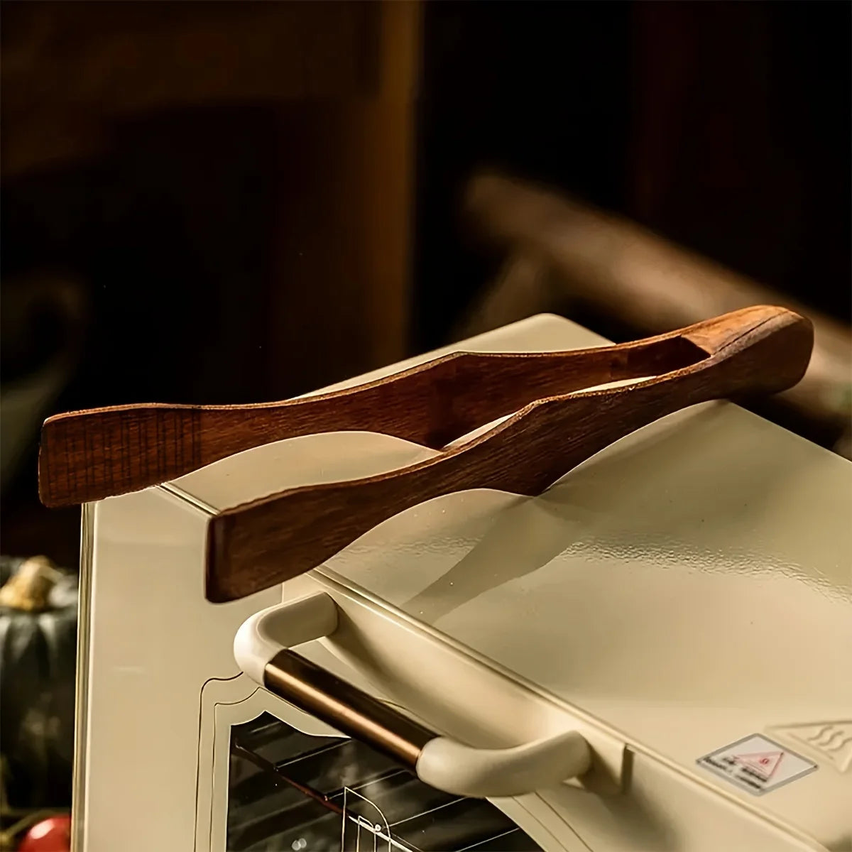 Showlu Smart General Mini Toaster Tongs in silver, showing their compact design and textured grip for handling toasted bread.