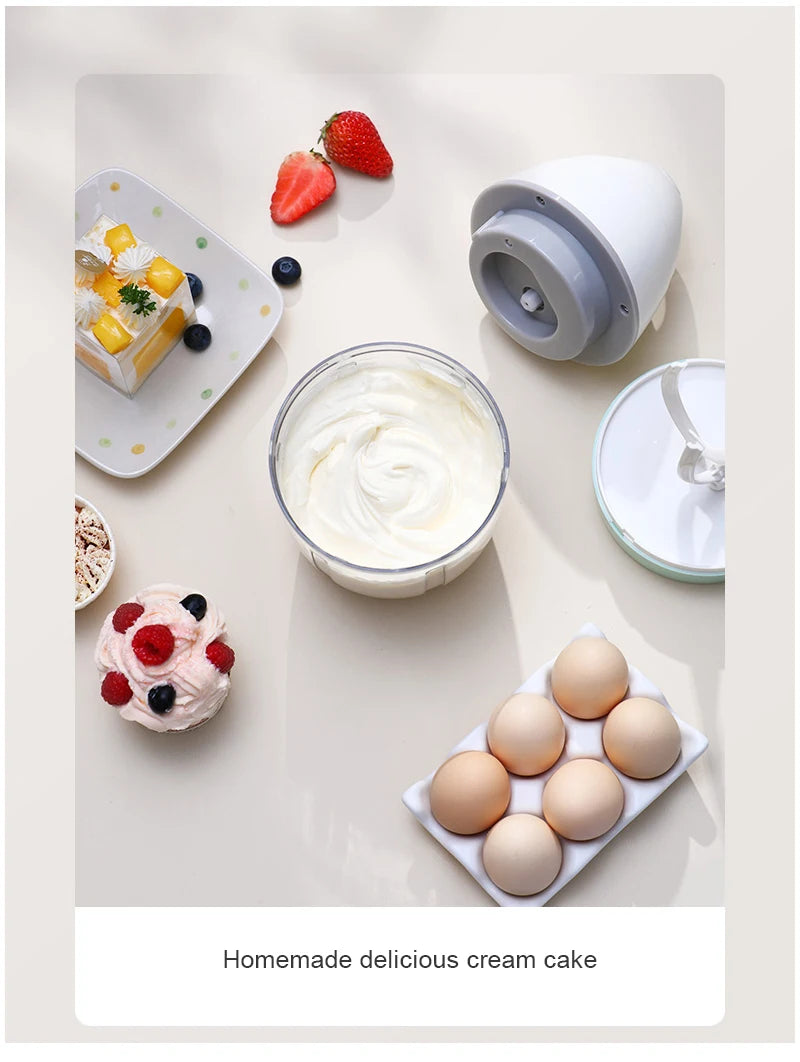 Showlu Smart General handheld USB electric egg beater mixer with mini whisk for cream and cake batter in a kitchen setting