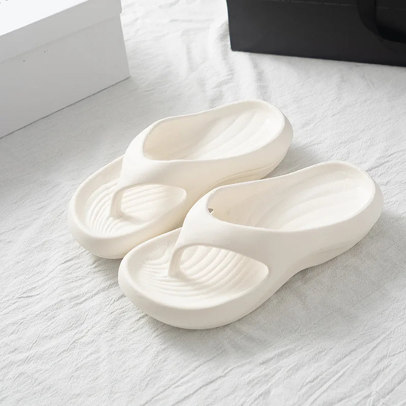 Comfortable white HININSEN women's thick platform EVA flip flops with soft cloud-textured soles, ideal for beach and casual wear.