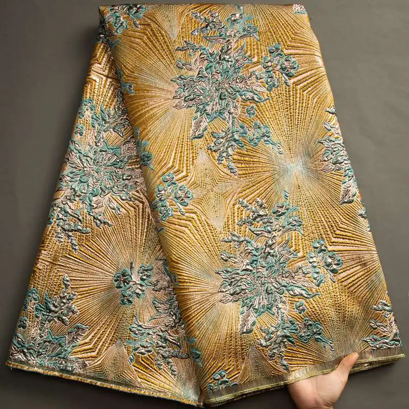 Close-up of CALEEBEAR floral brocade jacquard lace fabric featuring intricate Nigerian damask tulle design with vibrant floral patterns.