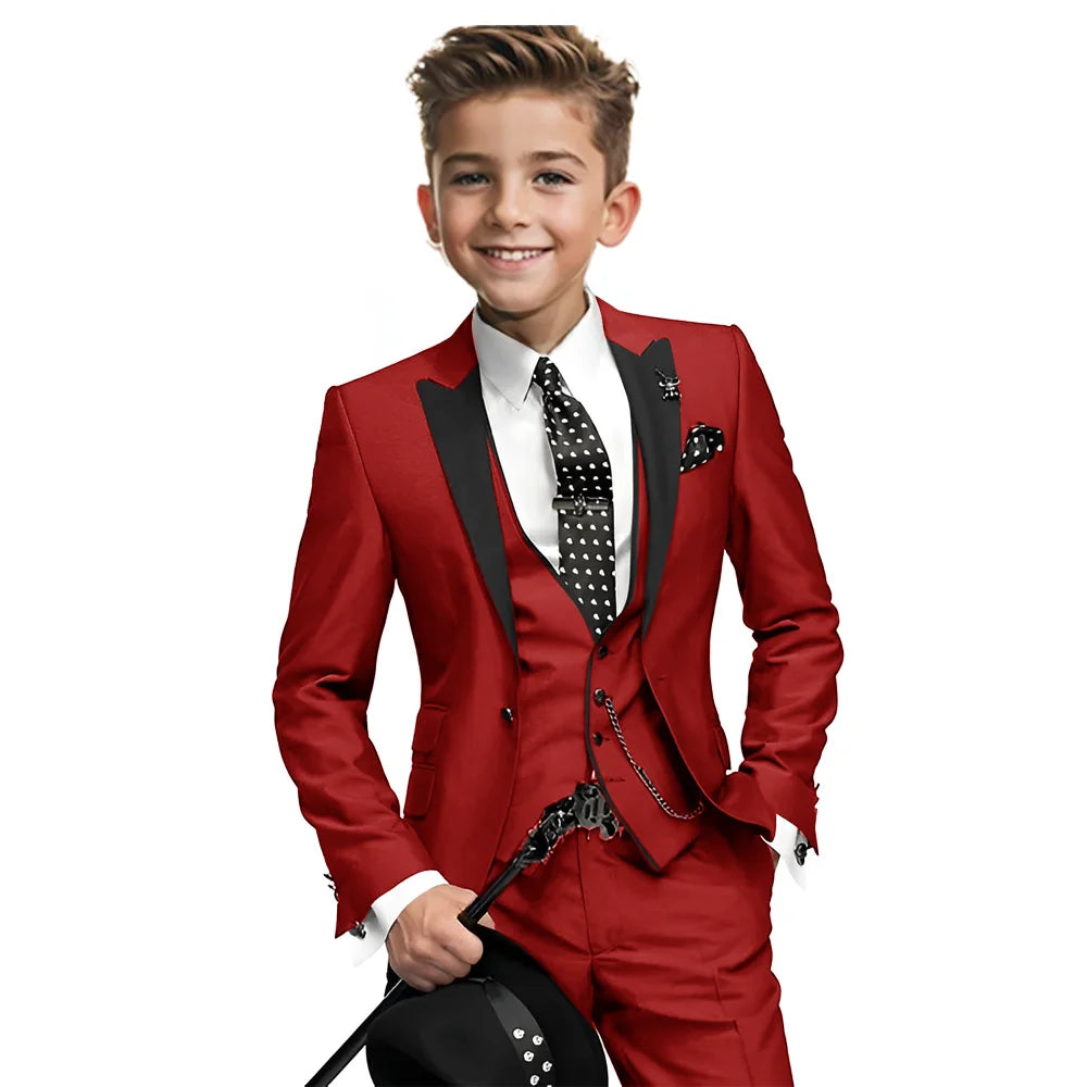Navy blue boys tuxedo suit with blazer, pants, and vest, suitable for weddings or formal events, for ages 2 to 16 years.