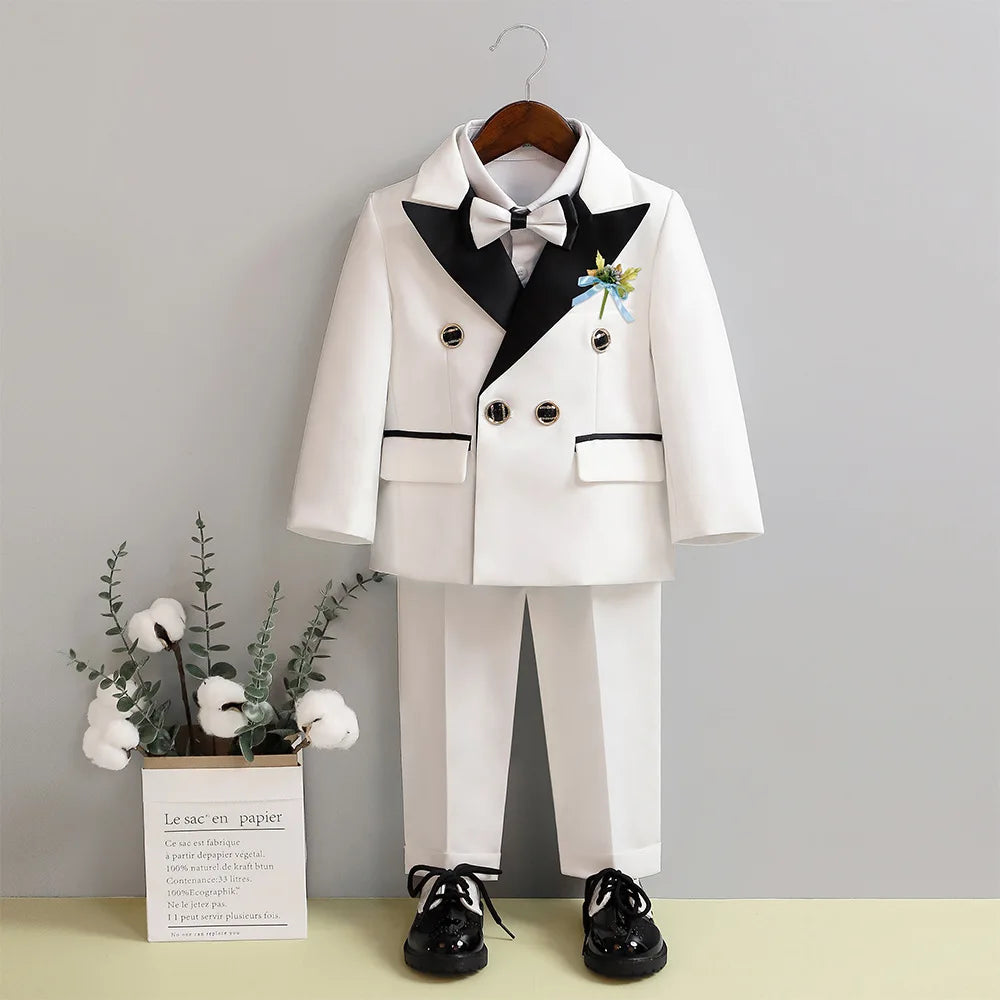 Children's white wedding suit with jacket, pants, and bowtie, perfect for flower boys and birthday parties by Showlu Fashion.