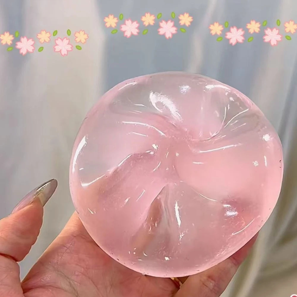 Transparent squishy maltose stress ball by Showlu Fashion Store, slow rise sensory ball for hand exercise and stress relief.