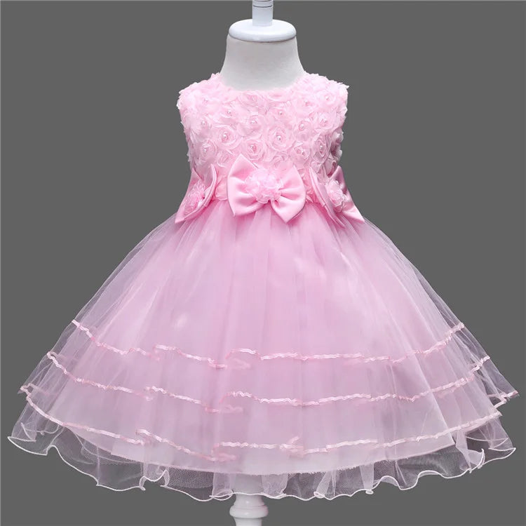 Pink princess style girls dress with mesh skirt, puffy design, sleeveless vest, ideal for wedding, party, or flower girl occasions.