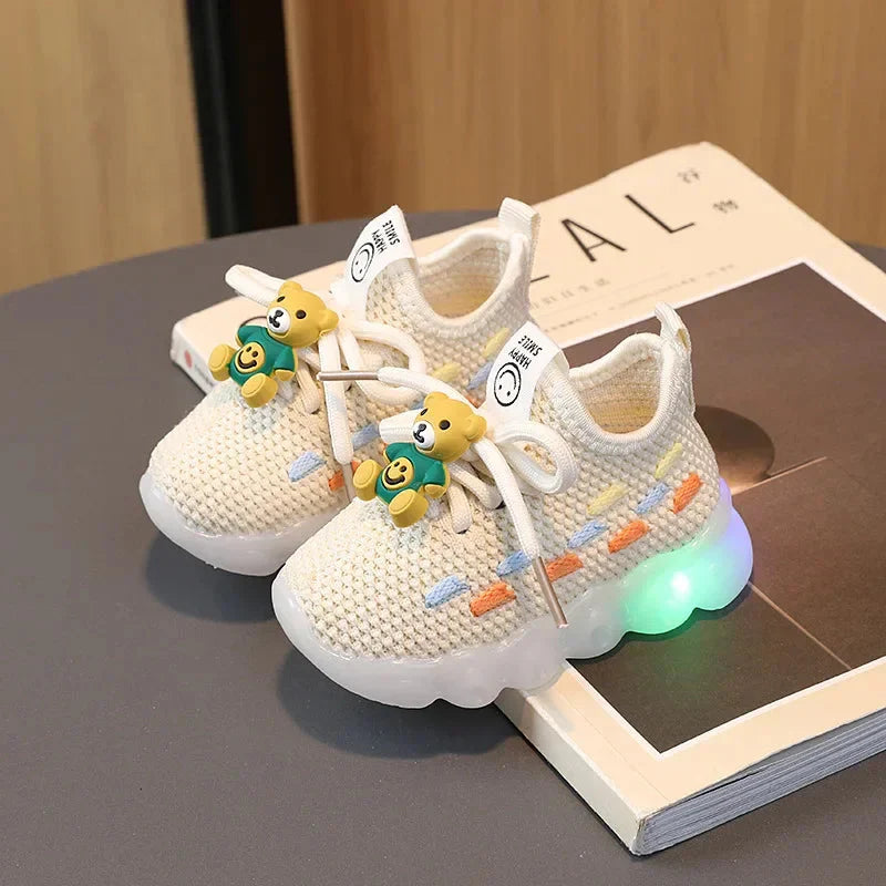 Luminous LED kids sneakers by Showlu Fashion Store, unisex PU leather shoes with glowing soles, perfect for children’s active wear.
