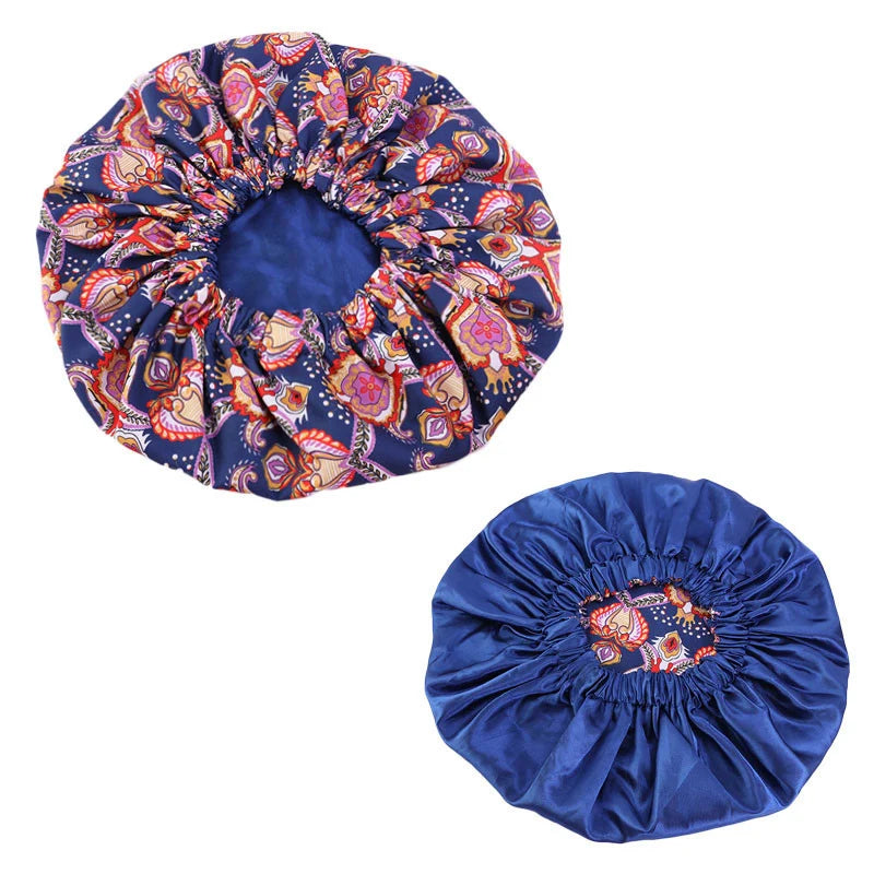Women’s African pattern Ankara print satin-lined sleep cap, soft large headwrap for hair care and comfort.