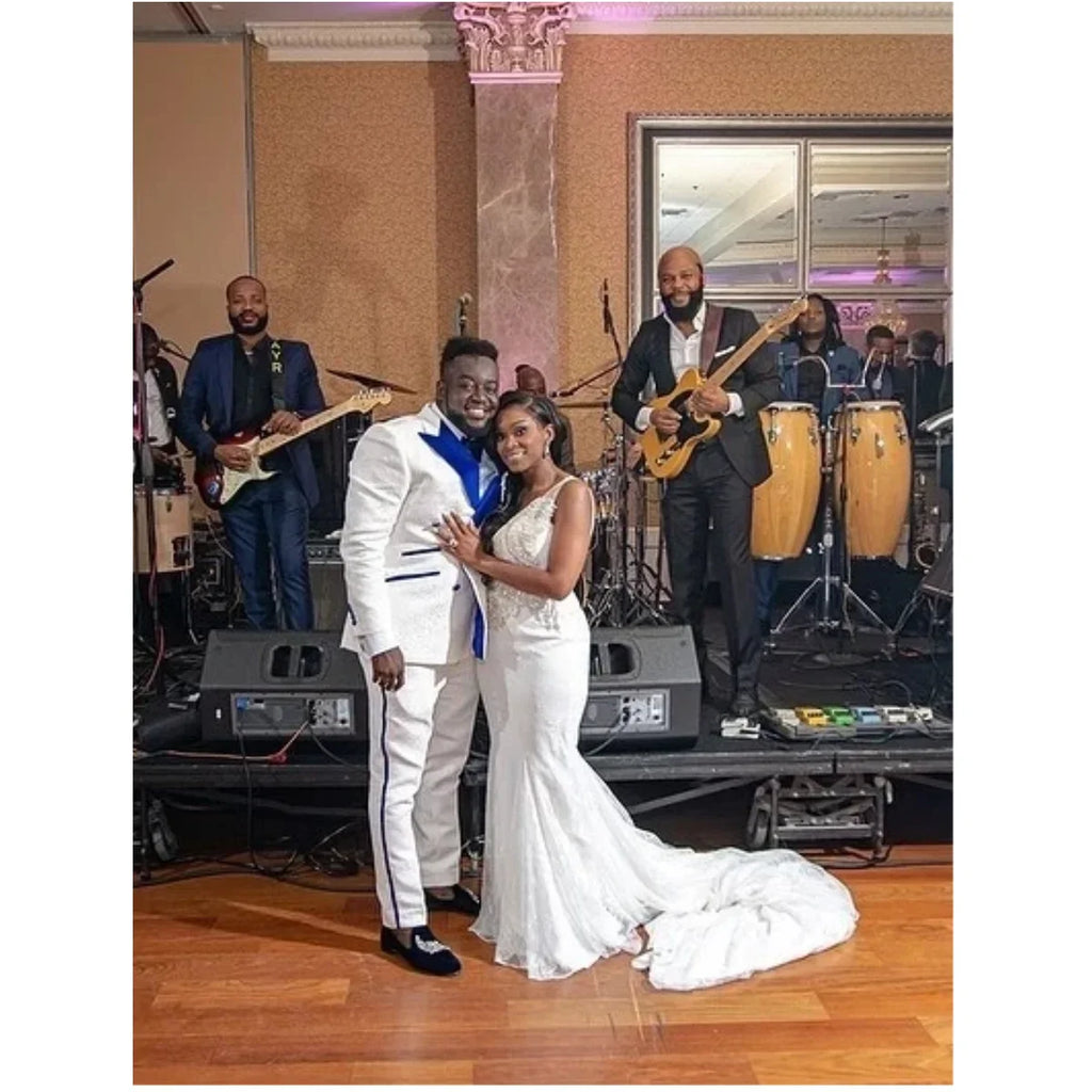 Elegant men's double-breasted floral jacquard wedding tuxedo with slim fit blazer and matching pants, featuring peak lapel and custom fit.