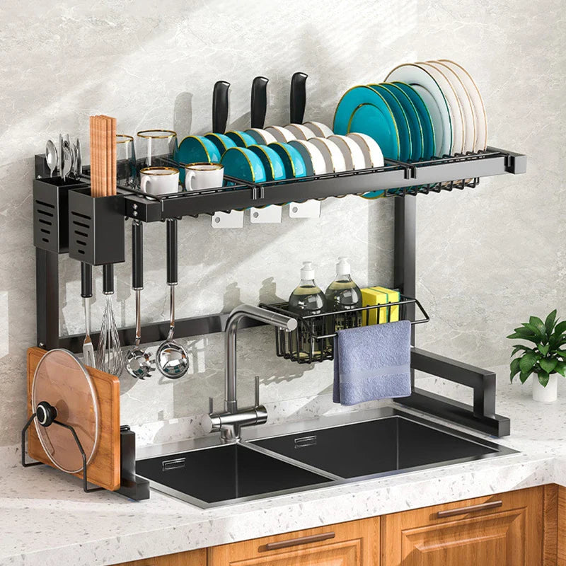 Stainless steel kitchen sink dish drain rack and utensil holder with multiple compartments for drying dishes and organizing utensils.