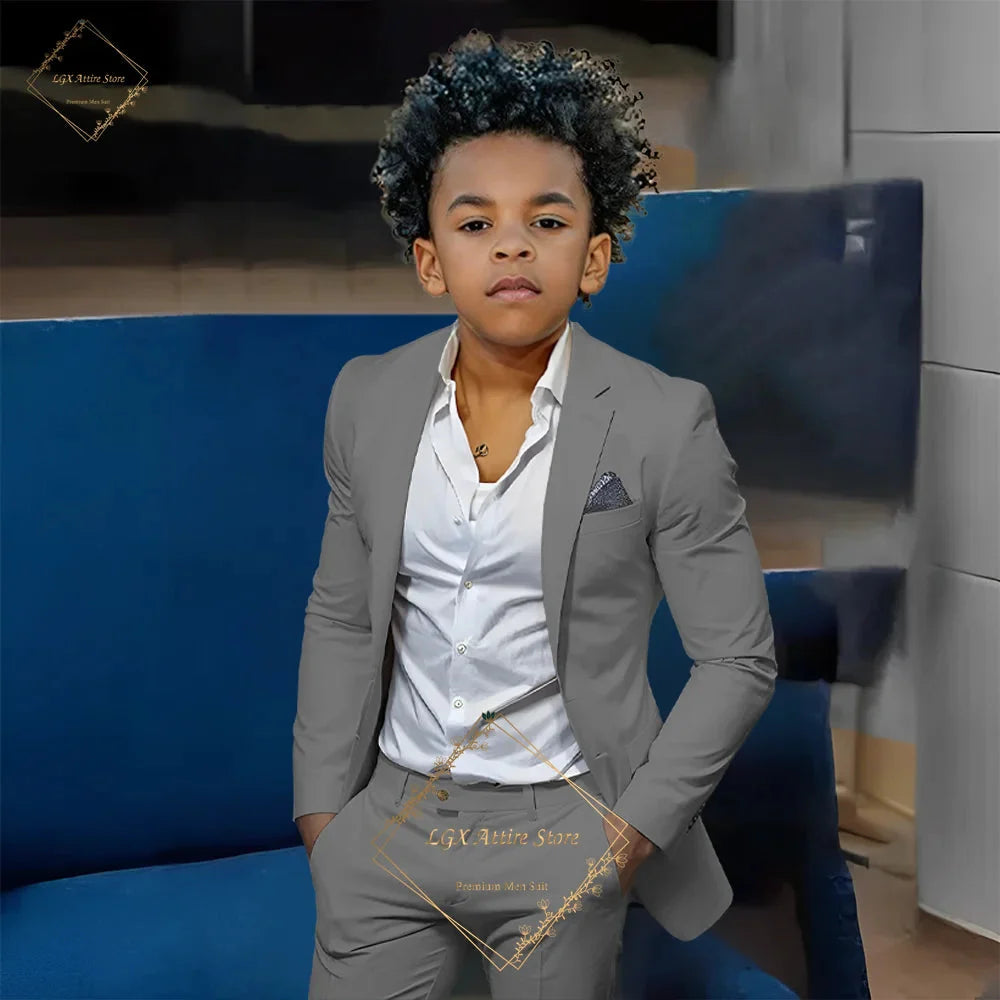 Orange slim fit boys' 2-piece suit by SHOWLU FASHION STORE, single-breasted twill set with jacket and matching pants.
