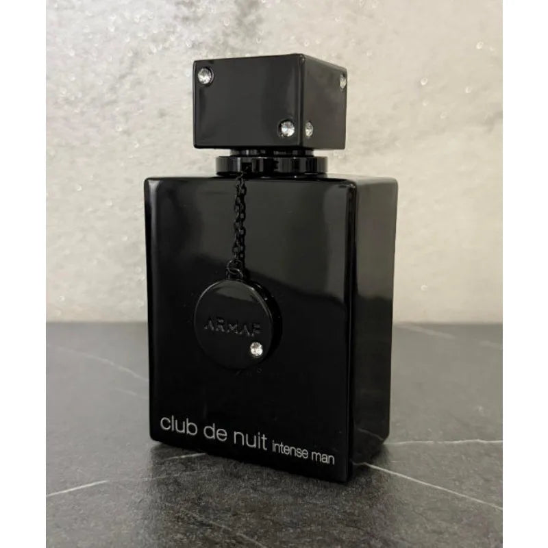 Long-lasting Sellion Woody Intense Eau De Parfum unisex fragrance in a 105ml spray bottle, featuring warm woody notes.