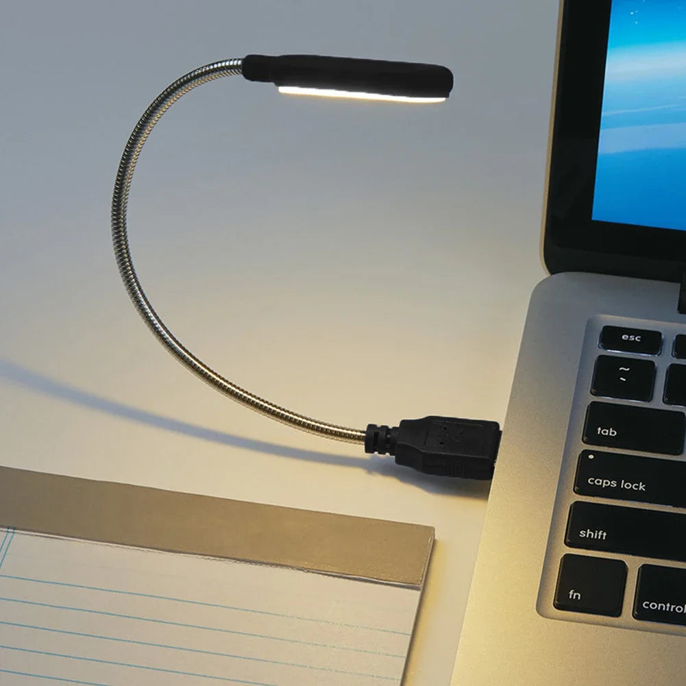Showlu Smart General USB LED Light connected to a laptop, providing focused illumination for workspace or travel use.
