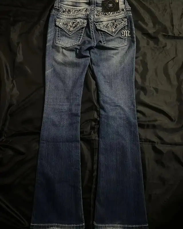 Vintage blue washed baggy jeans with sequin pockets, mid-rise fit, and slim silhouette, perfect for Y2K streetwear style.