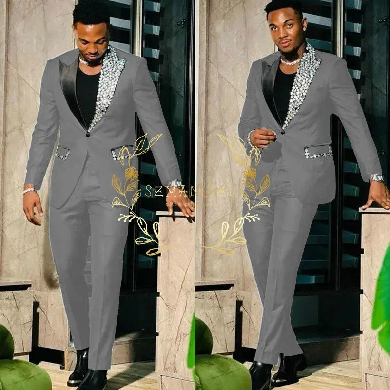 Black men's slim fit suit with single-breasted blazer and pants, featuring peak lapel and crystal accents for prom or formal events.