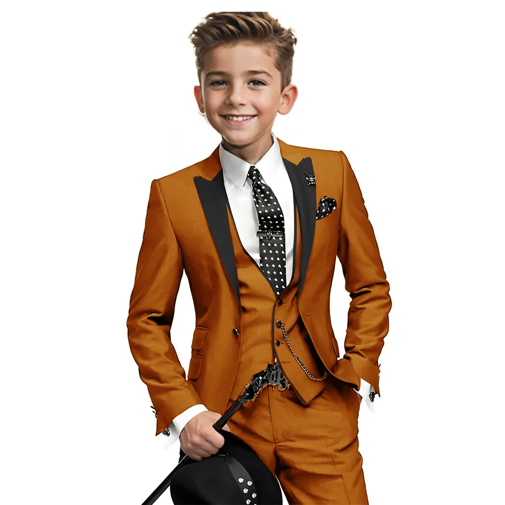 Navy blue boys tuxedo with blazer, pants, and vest from Showlu Fashion, suitable for formal weddings and special occasions.