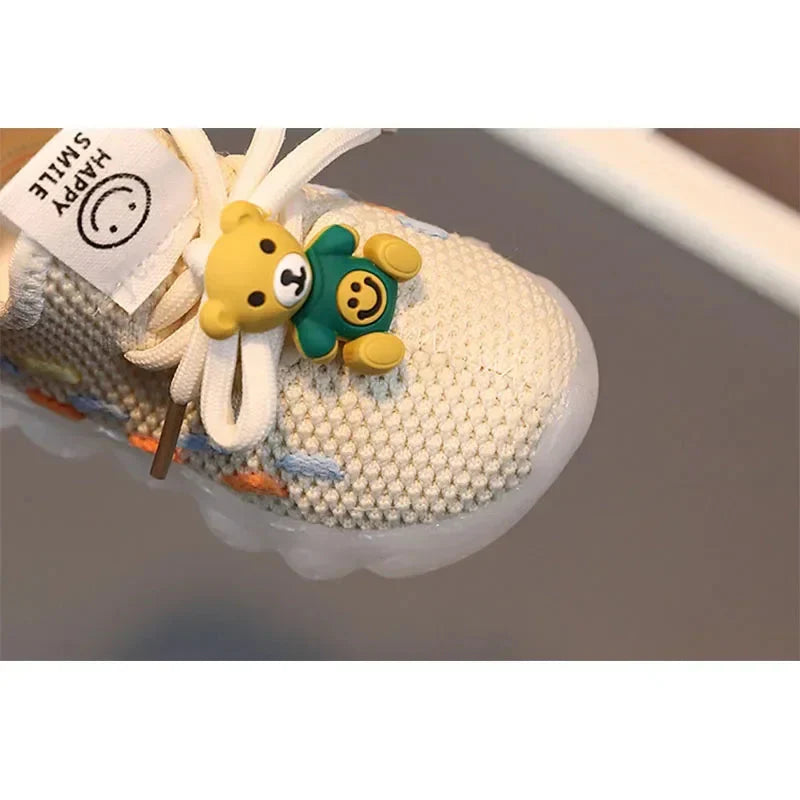 Unisex luminous LED sneakers for kids by Showlu Fashion Store, featuring PU leather material and glowing light accents.
