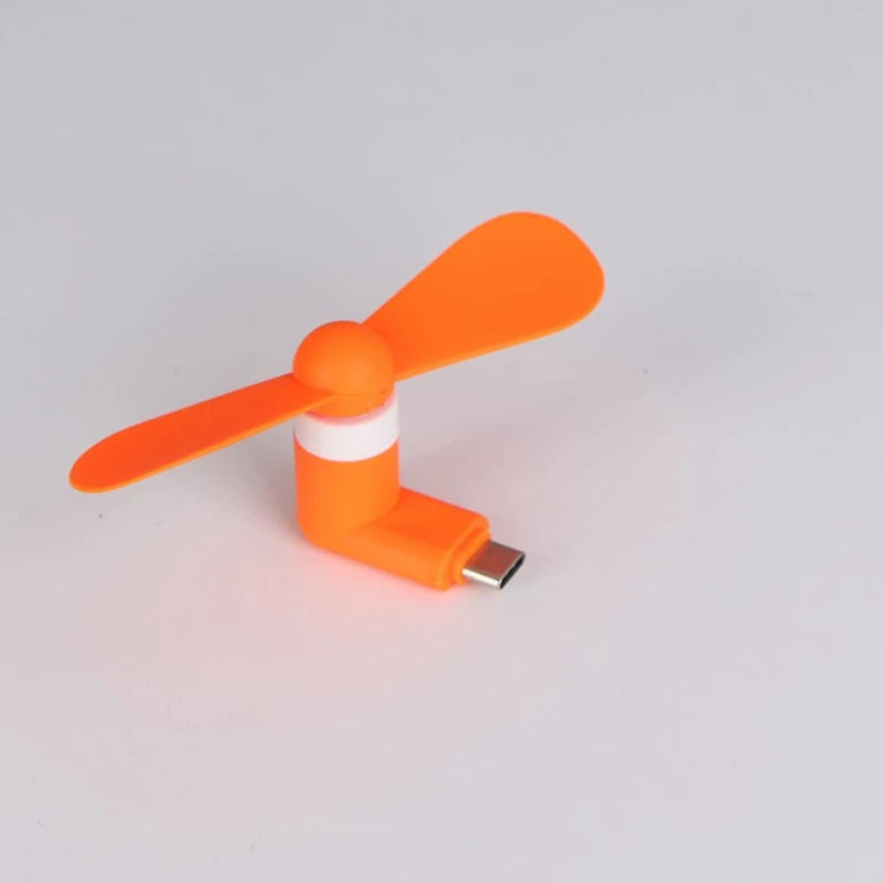 Showlu Smart General USB mini fan with adjustable blades and compact design, ideal for portable cooling on the go.