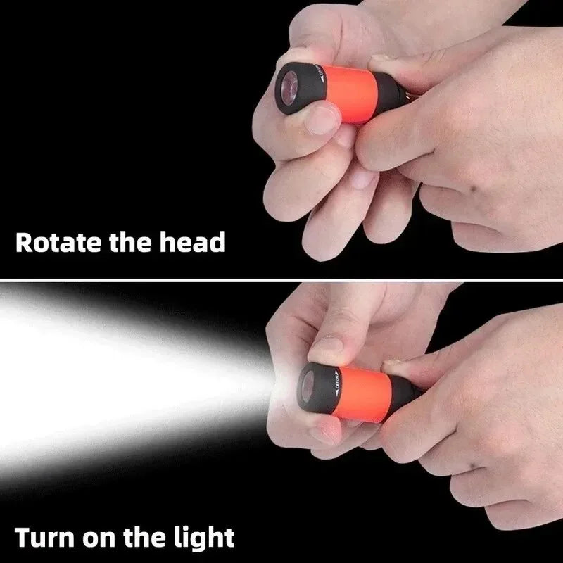 Portable LED micro flashlight from SHOWLU Fashion Store, USB rechargeable keychain light with compact design and bright illumination.