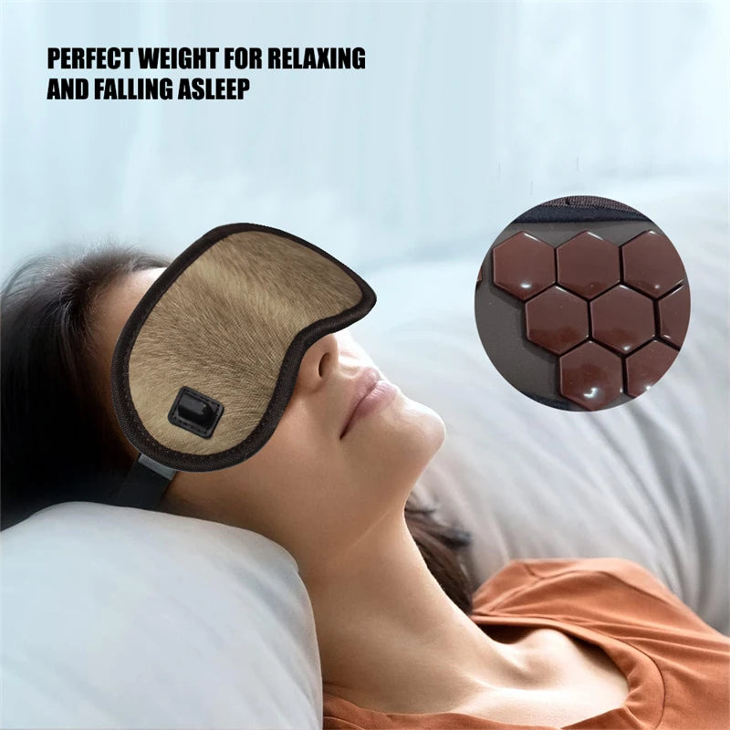 Showlu Smart General Maelsrom Electric Heat Eye Massage Mask resting on a person's face with adjustable straps and soft fabric.