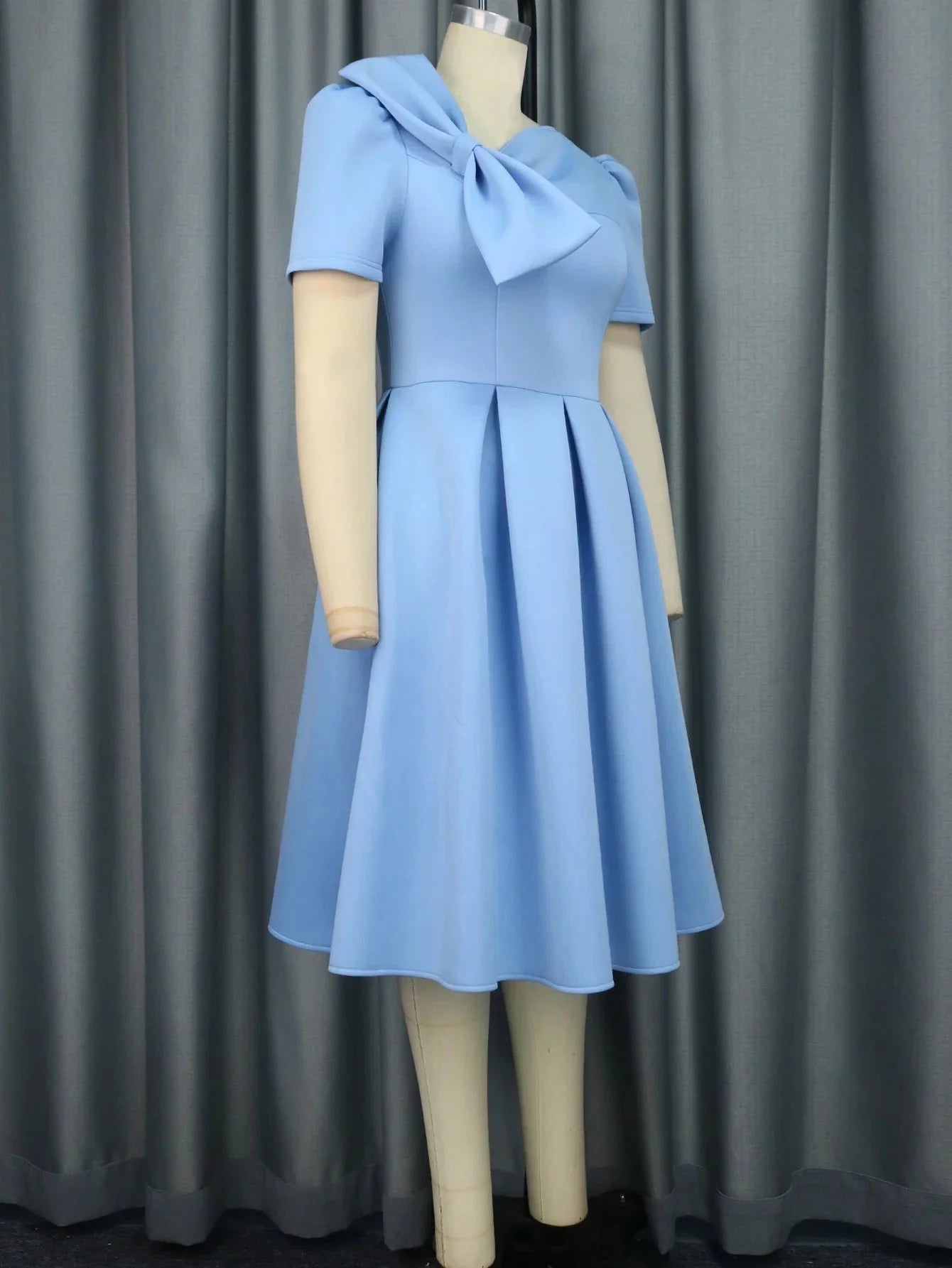 Aimee Women's Bow A-Line Skater Dress in elegant scuba fabric, perfect for parties, showing the dress's bow detail and flared skirt.