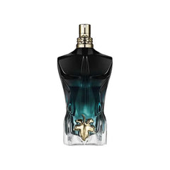 A Jean Paul Gaultier Le Beau Le Parfum bottle shaped like a male torso with a gold leaf emblem.