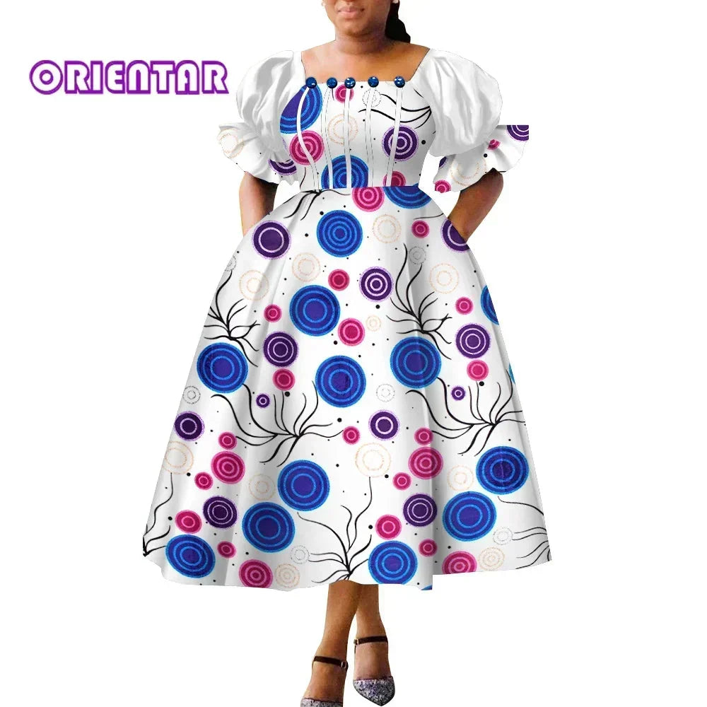 African print puff sleeve high waist Ankara cotton gown by SHOWLU FASHION STORE, featuring vibrant patterns and a flowing silhouette.