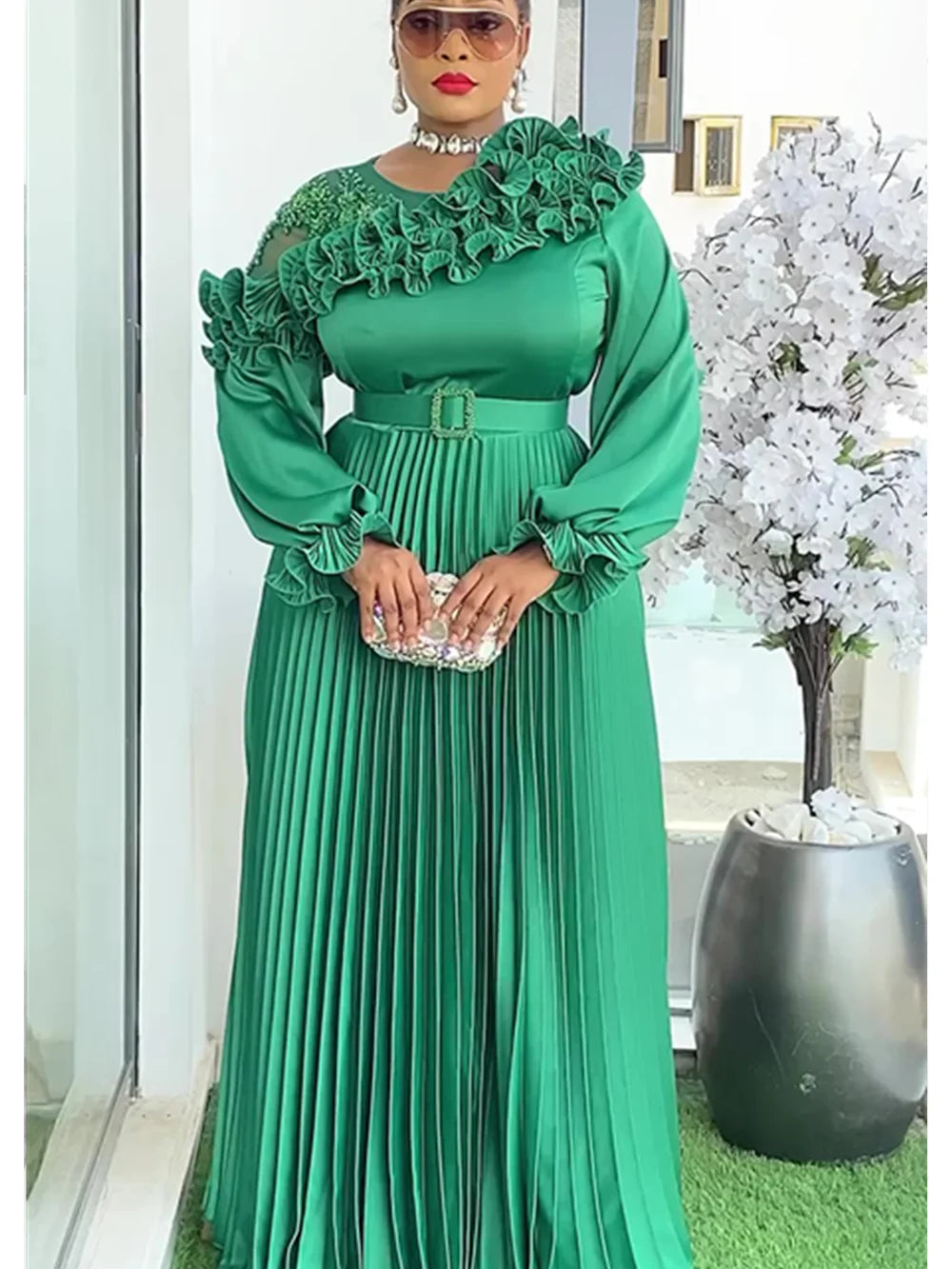 Plus size African party dress for women, elegant Ankara wedding evening gown with dashiki design, featuring vibrant colors and flowing fabric.