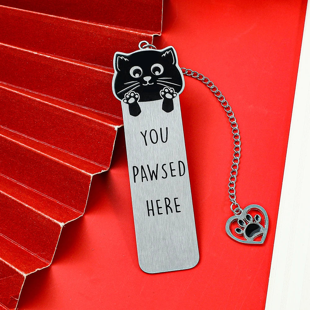 Colorful stainless steel waving cat bookmark with geometric design, featuring vibrant hues and compact shape for book marking.