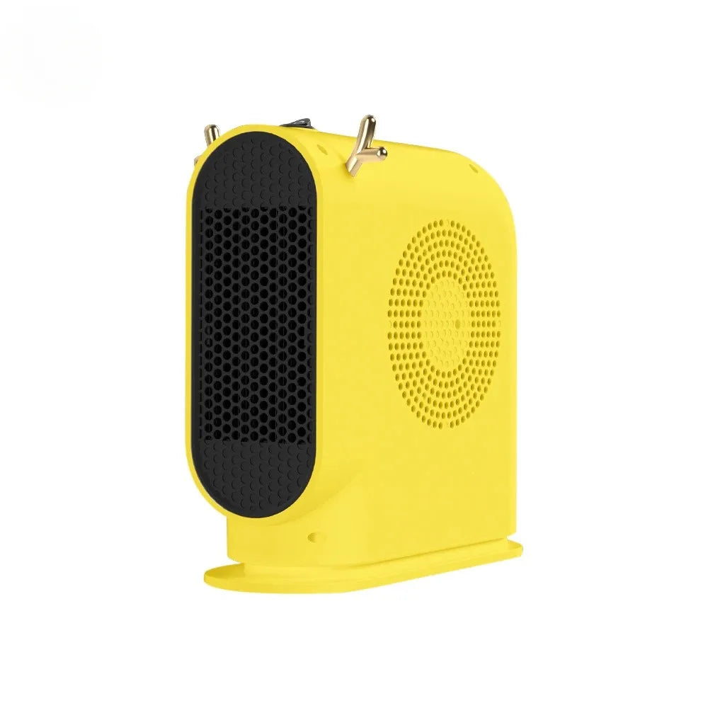 Showlu Smart General portable 500W electric desktop space heater fan on a desk, compact and easy to use for personal heating.