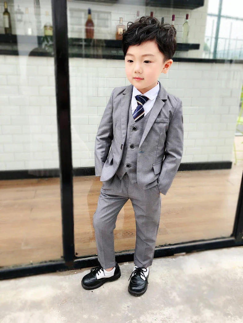 Boy's formal wedding suit by LUOBOBEIBEI, includes cotton blazer, vest, and pants, perfect for special occasions and ceremonies.