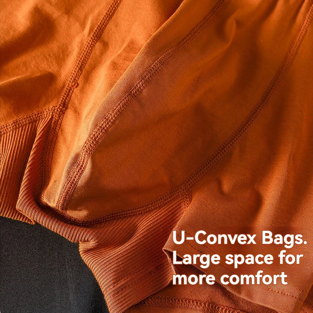 Three pairs of Showlu Fashion men's cotton antibacterial boxers with double-layer breathable U pouch in a pack.