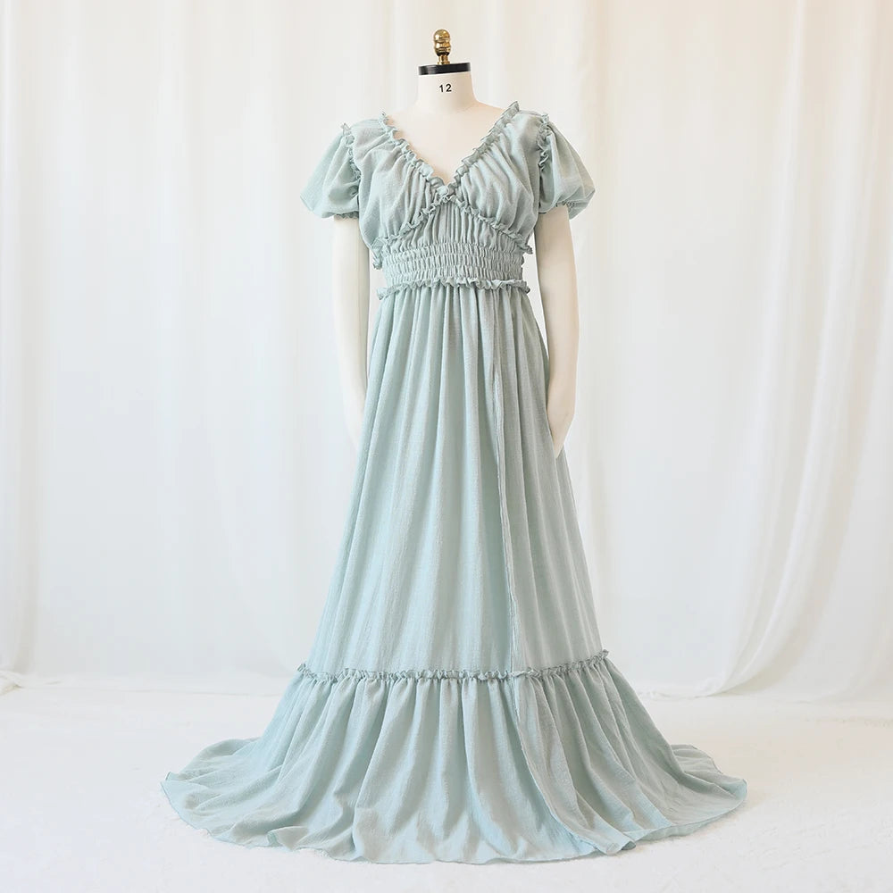Showlu Bohemian maternity maxi gown with off-shoulder ruffled design, flowing fabric, perfect for maternity photography and special occasions.