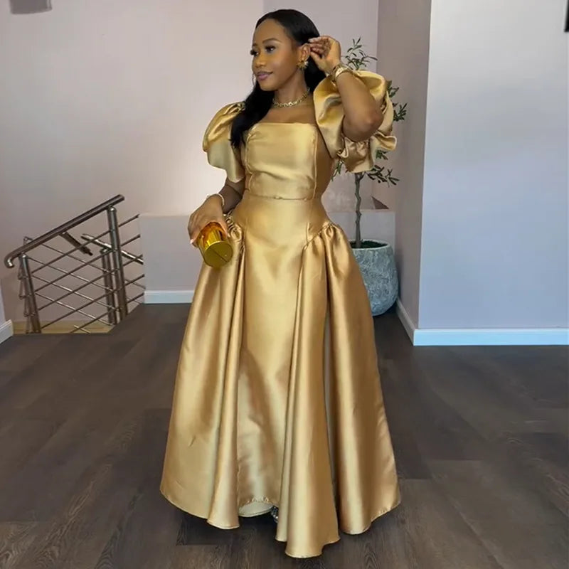 Elegant women's puff sleeve dress with square collar, gold solid pleated A-line design, suitable for evening and party occasions.